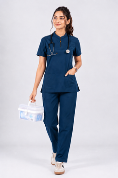 Person wearing a navy blue medical scrub set with a stethoscope, holding a medical bag on a white background
