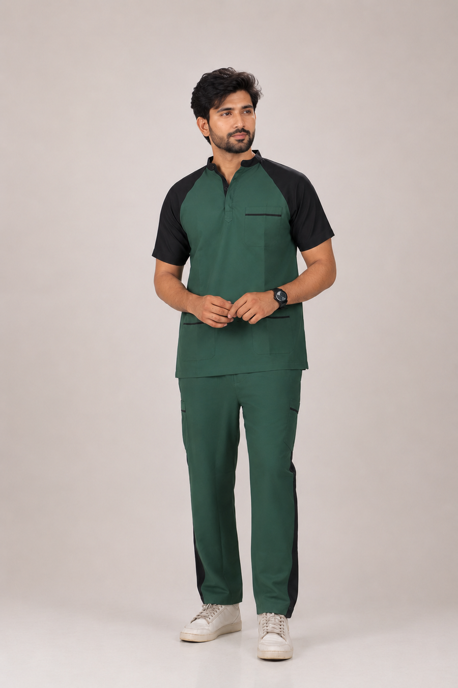 Man wearing a green and black outfit on a plain background